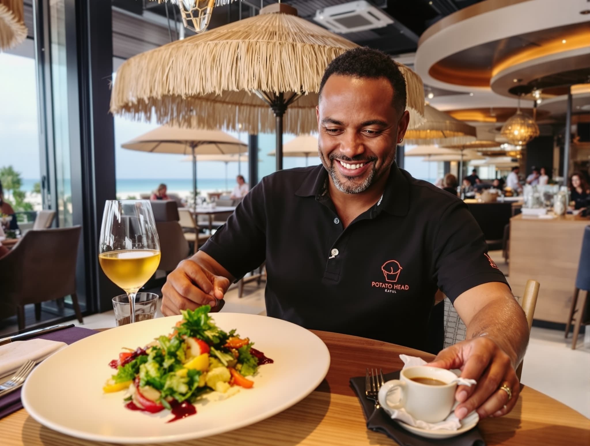 Kaum at Potato Head restaurant in Seminyak, Bali — the fine dining Balinese restaurant with beachside seating mentioned in the article as a key Seminyak dining destination.