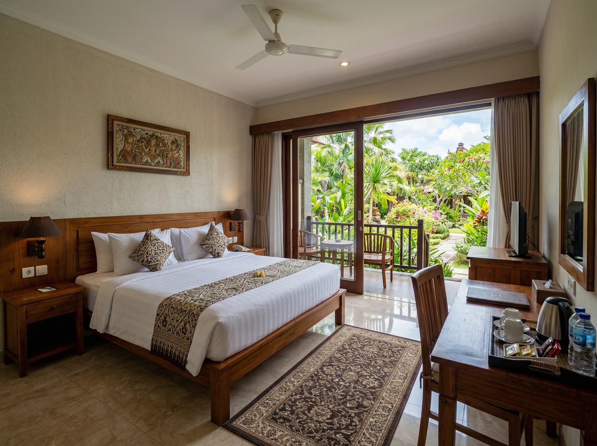 Interior or terrace view of a Deluxe Room at Bintang Bali Resort — showing the balcony, tropical garden view, and room furnishings that represent the entry-level room category reviewed in the article