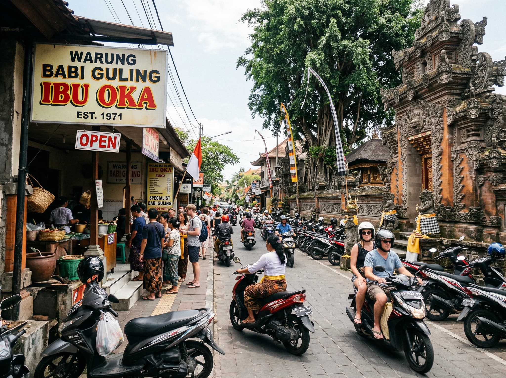 The exterior of Warung Babi Guling Ibu Oka on Jalan Tegal Sari in Ubud, with Puri Saren Agung — the Ubud royal palace — visible across the street, showing the warung's iconic central location in the heart of old Ubud