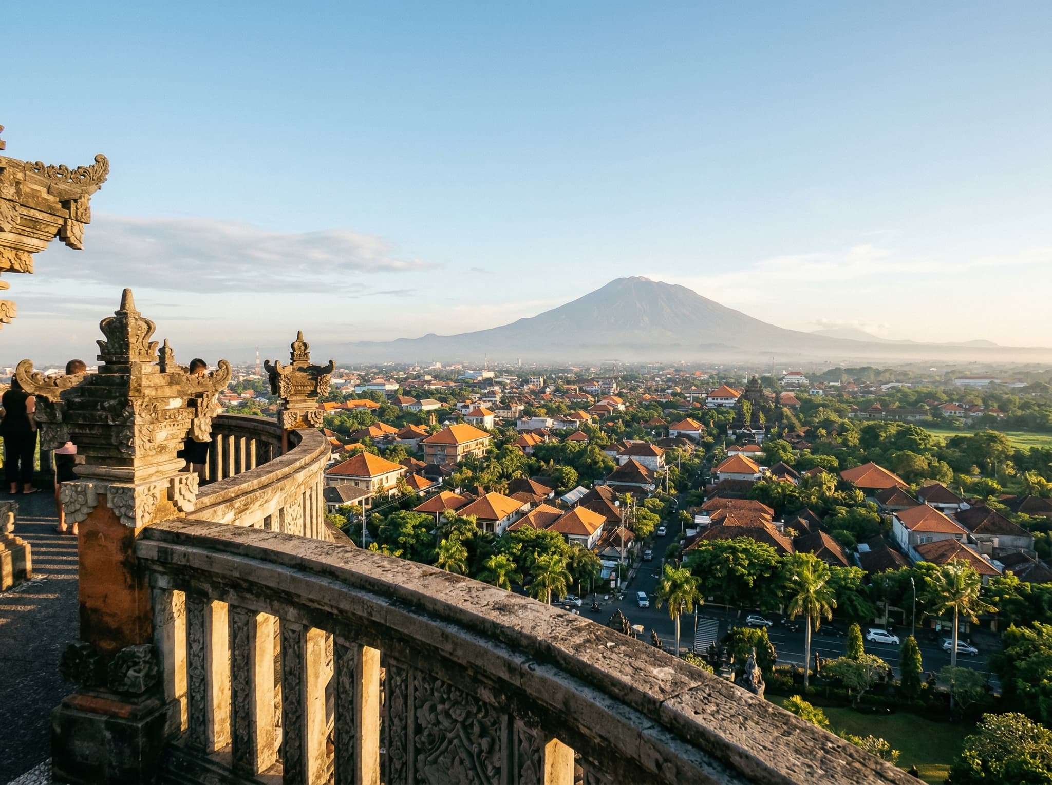 Panoramic view from the Level 3 observation deck of the Bajra Sandhi Monument, looking northeast toward Mount Agung — the reward for climbing the monument's narrow spiral staircase on a clear morning