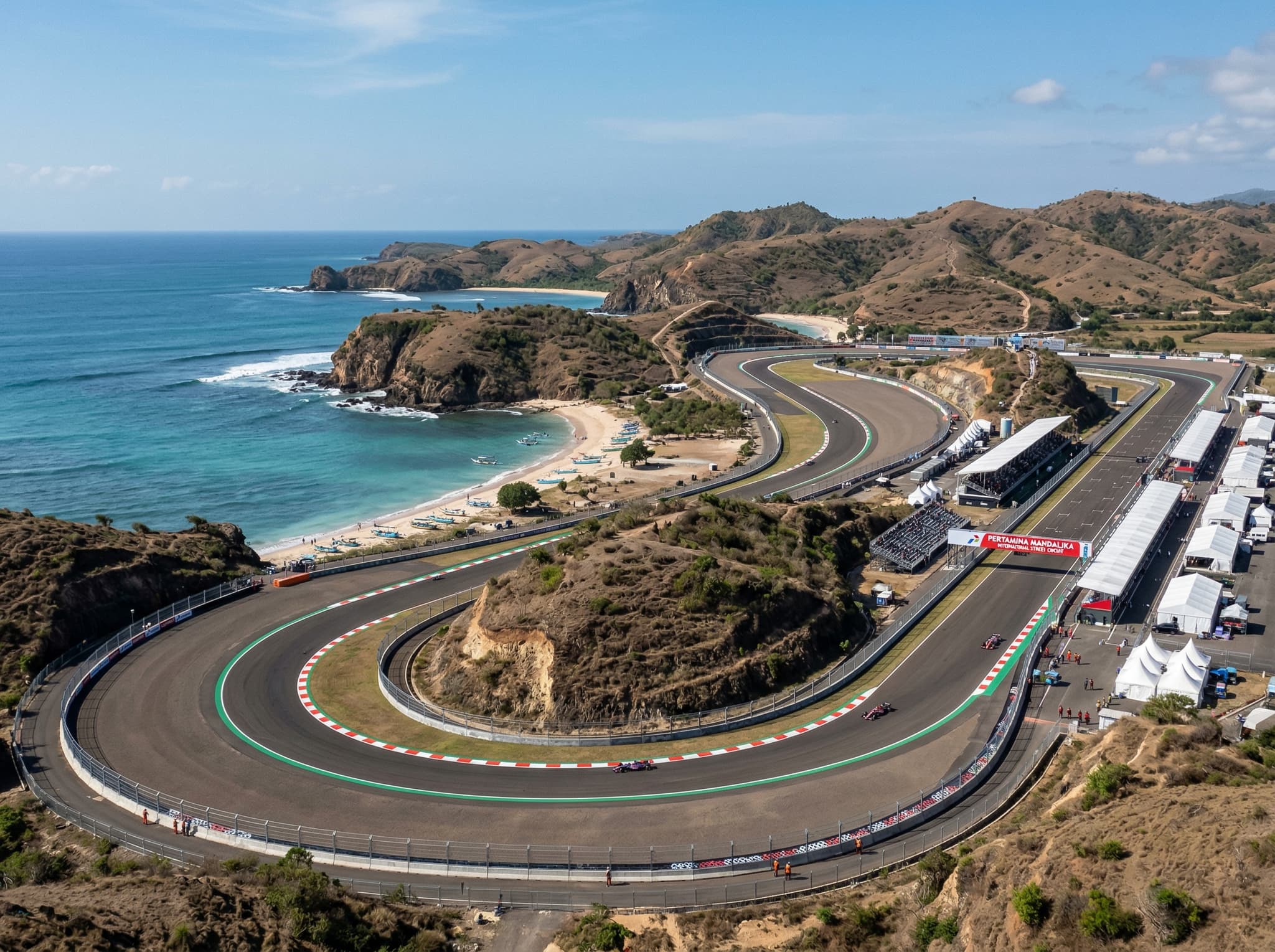The Pertamina Mandalika International Street Circuit from an elevated vantage point, showing the track winding along the coastal headland near Kuta Lombok — illustrating the scale of infrastructure investment that defines the Mandalika Special Economic Zone