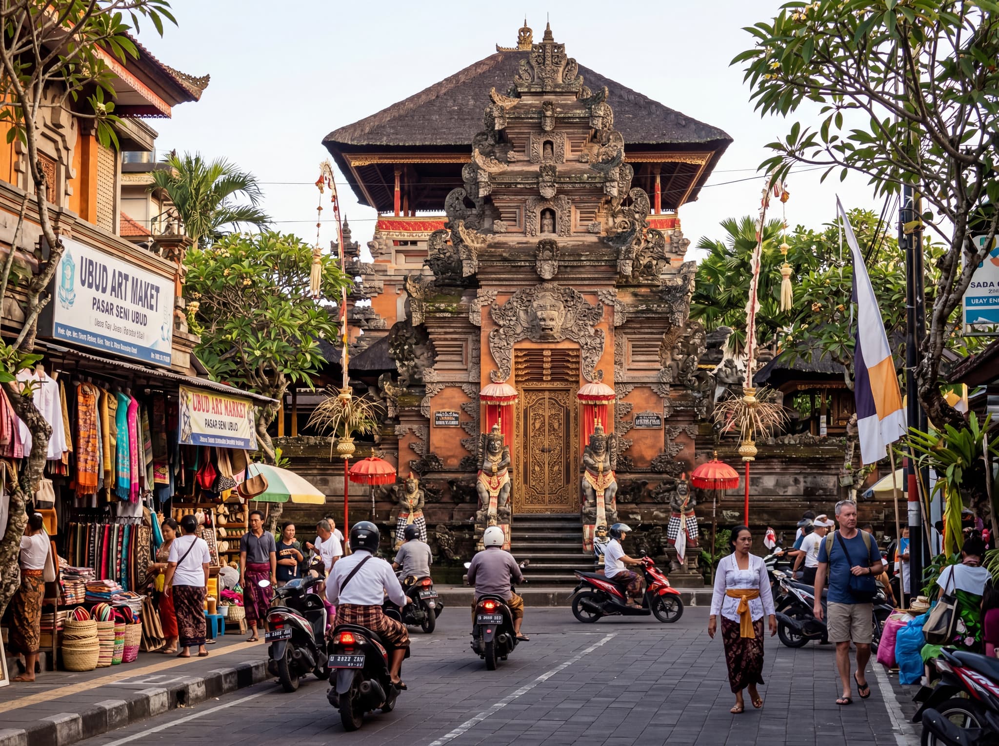 Ubud Palace (Puri Saren Agung) in Ubud, Bali, viewed from street level on Jalan Raya Ubud — the ornate Balinese gate and stone carvings visible across from the market, establishing the landmark that makes the Art Market easy to locate and contextualizing the article's repeated reference to the palace as the market's landmark neighbor