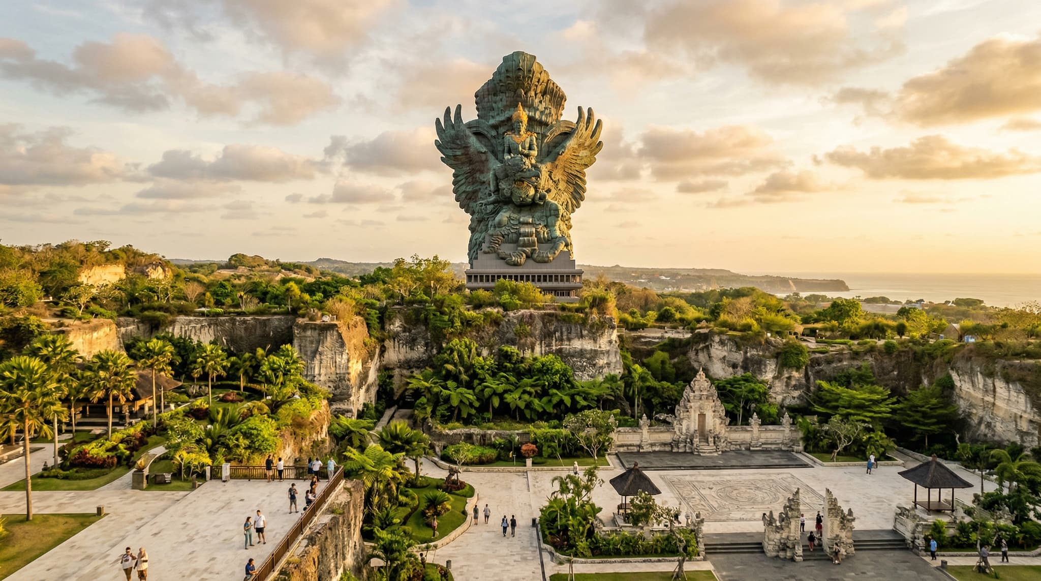 The Garuda Wisnu Kencana statue rising 121 meters above the limestone plateau of GWK Cultural Park in Ungasan, Bali — the monumental copper-and-brass figure of Vishnu riding Garuda that anchors the entire park and draws visitors from across the island