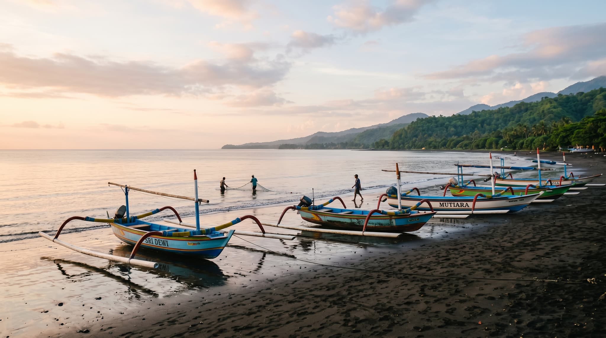 Lovina's dark volcanic black-sand beach at dawn, with traditional Balinese jukung outrigger fishing boats resting on the shore and calm, flat water stretching toward the horizon — establishing the quiet, unhurried character of Bali's north coast that the article promises