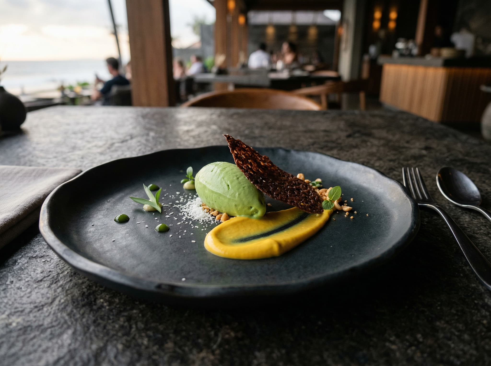 A plated dessert course at Mejekawi featuring botanical Indonesian flavors — pandan, turmeric, or East Javanese cacao — representing the restaurant's restrained, ingredient-led approach to the final courses of the tasting menu.